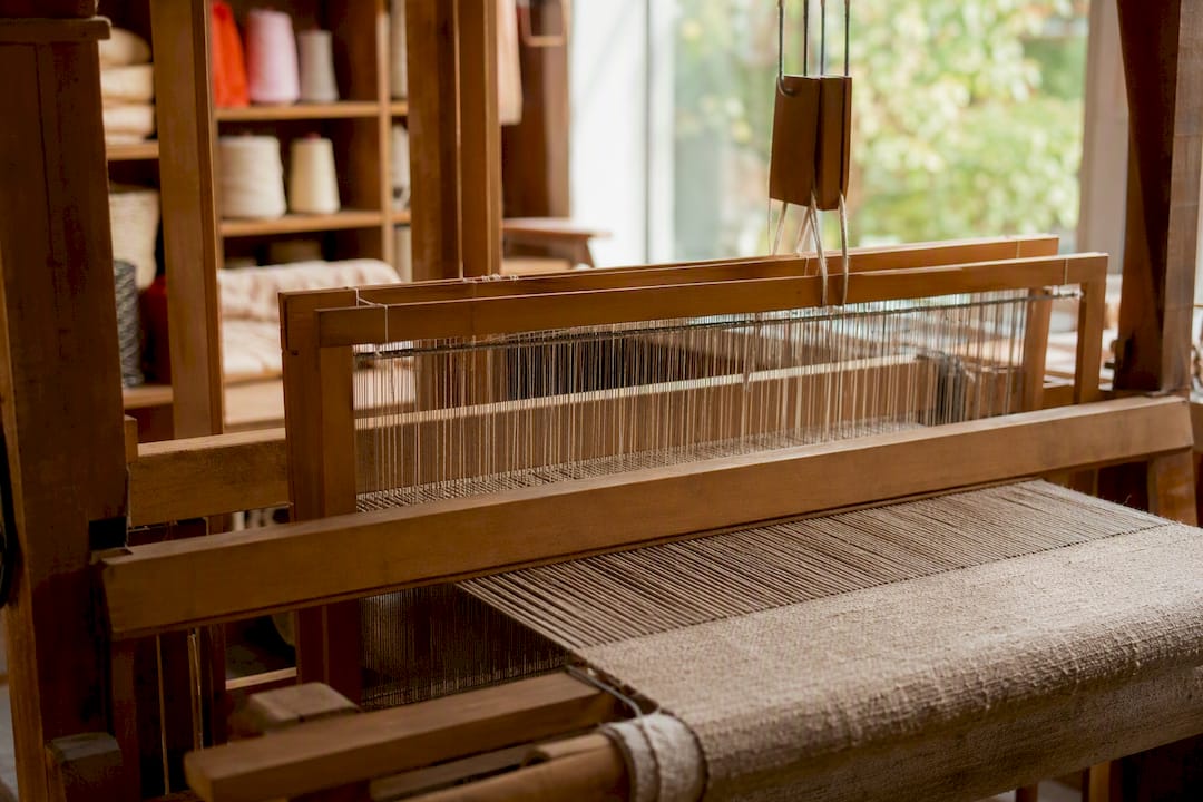 Close-up of weaving yarns on loom