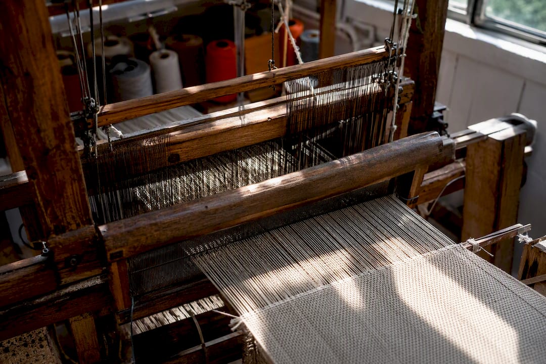 Close-up of warp and weft threads on loom