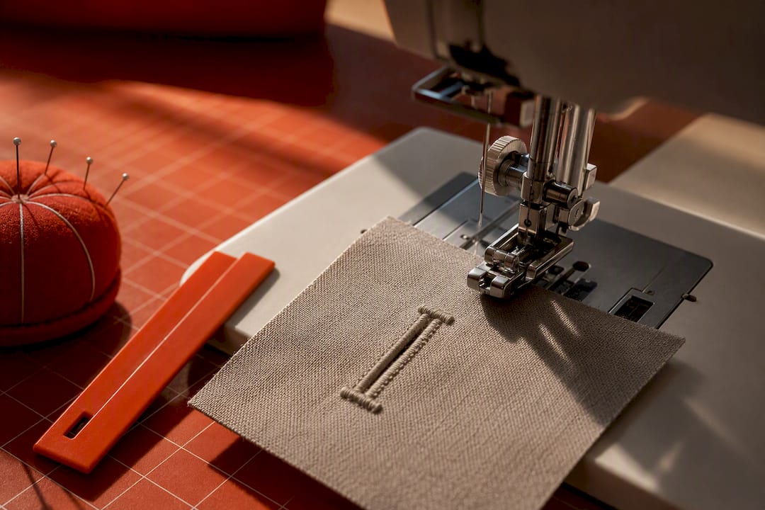 Close-up of a test buttonhole under presser foot