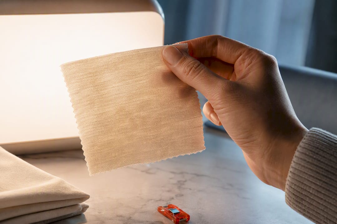 Sewist examining cotton jersey swatch