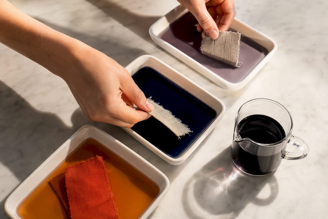 Fabric swatches being tested in dye baths
