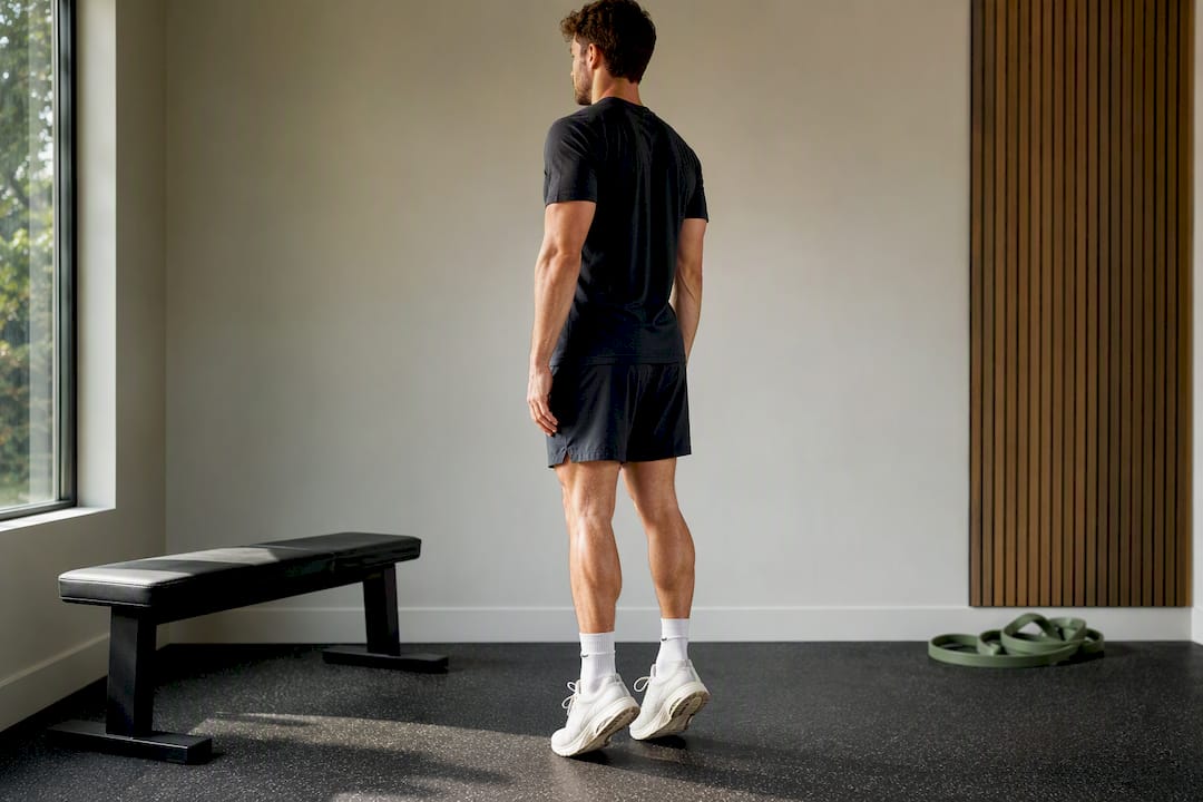 Runner performing controlled calf raises