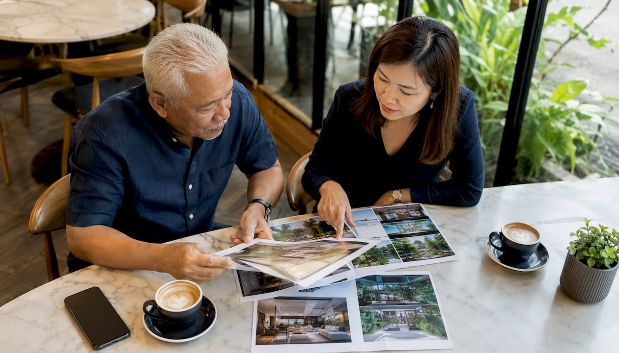 Two agents reviewing real estate lead services