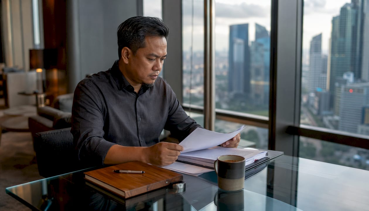 Hands reviewing real estate law documents