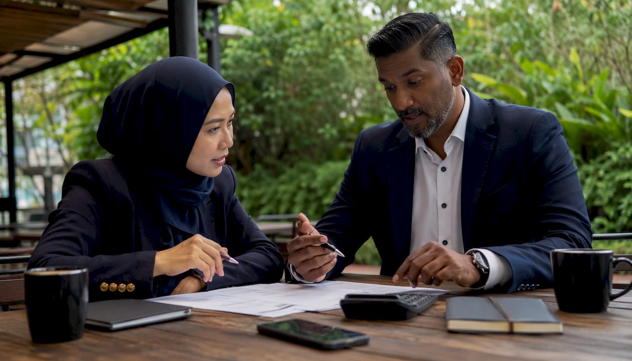Two agents discussing agency splits and deals