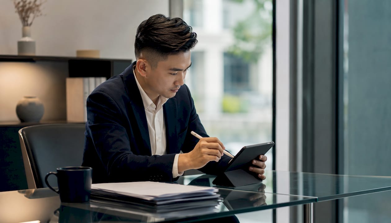 Close-up hands using tablet for property portals