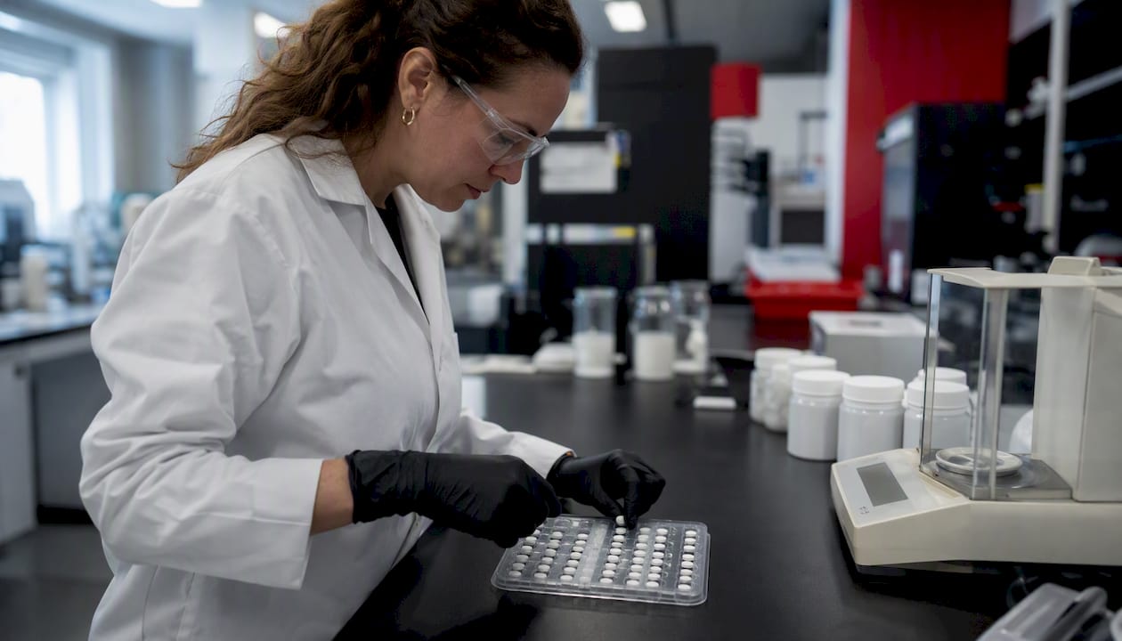 Close-up of tablet content uniformity testing in lab