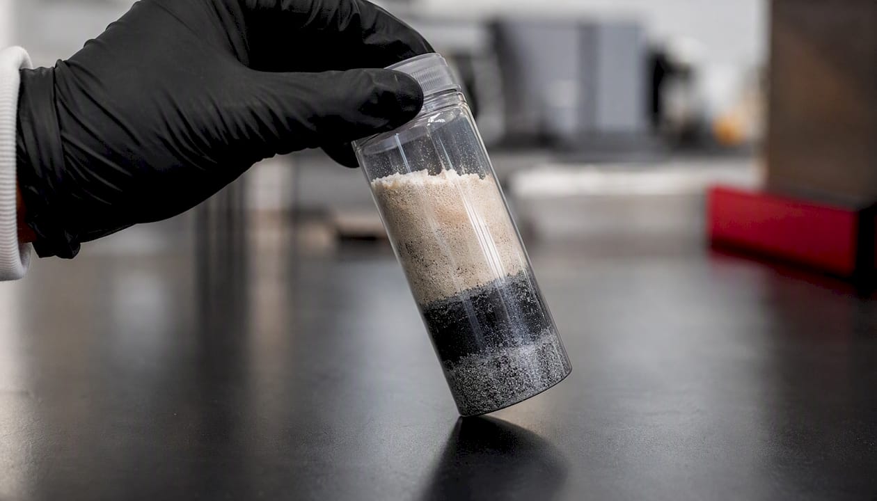 Layered alkaloid powder in lab container