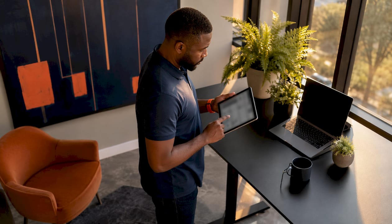 Technician interacting with scheduling tablet