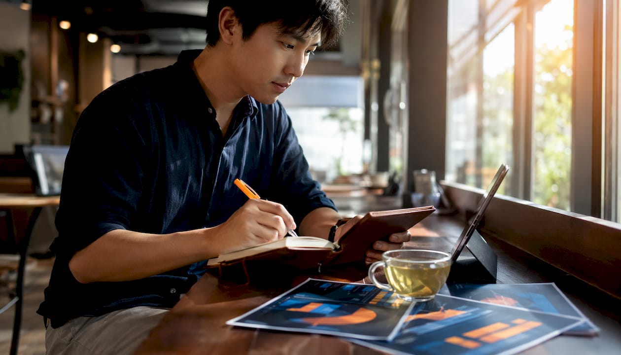Man taking notes during sales training session