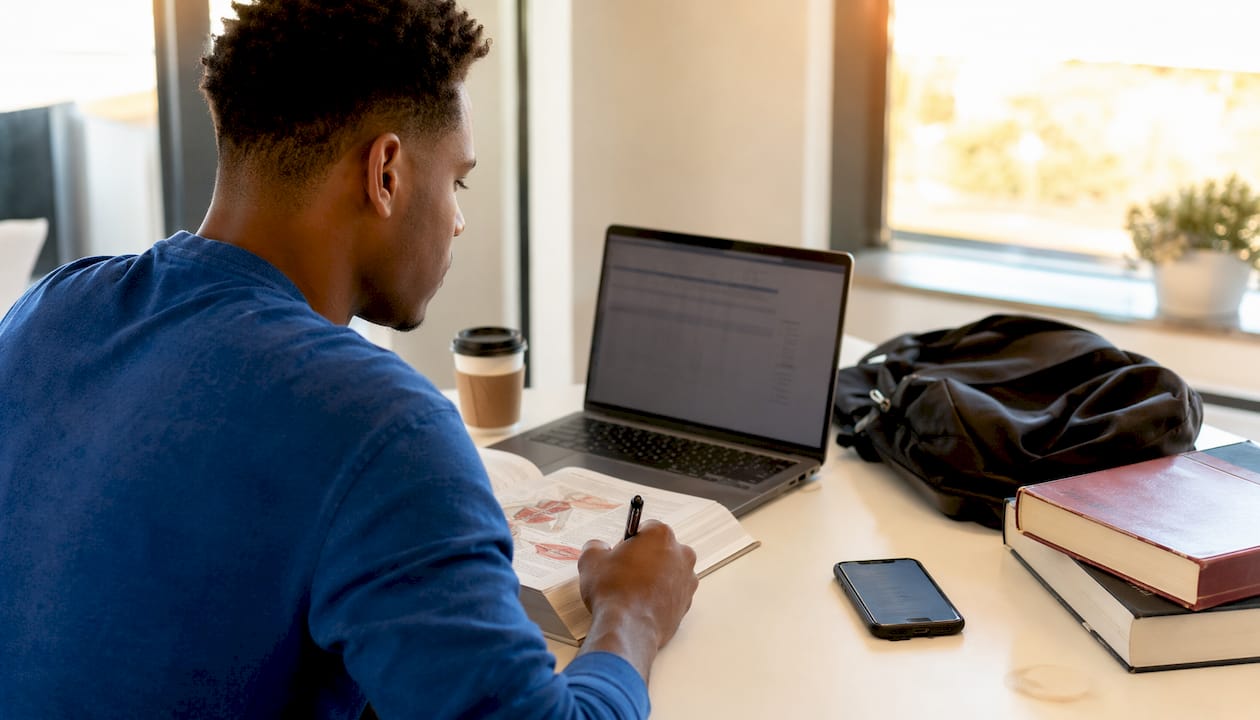 Student comparing spreadsheet and tracking app
