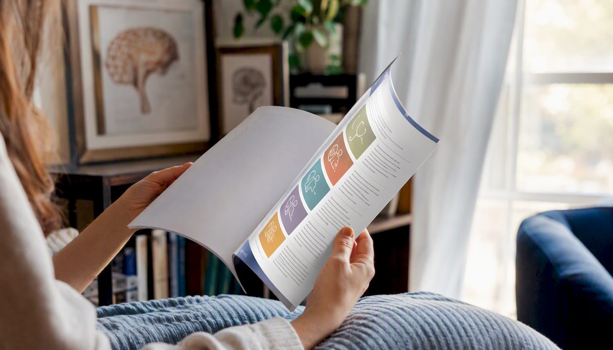 Hands holding medical specialties reference guide