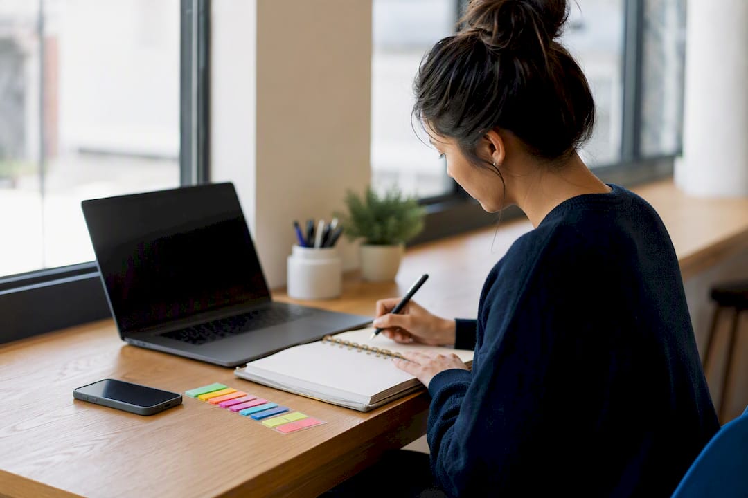 Organized desk with secondary application tracking tools