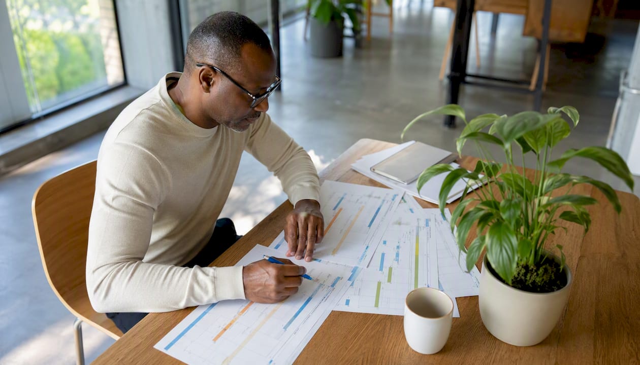 Man evaluating campaign measurement printouts