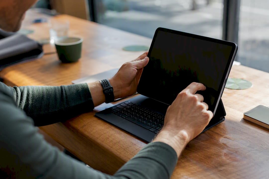 Hands adjusting bid limits on a device