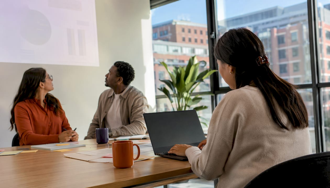 Professionals using captioning in meeting room