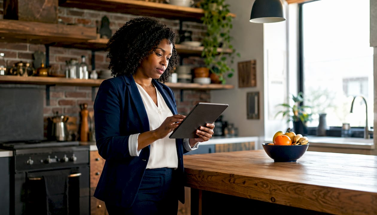 Woman browsing refinance programs on tablet