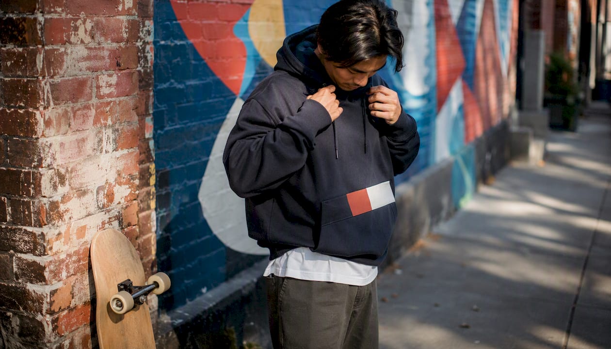 Skateboard and streetwear hoodie urban scene