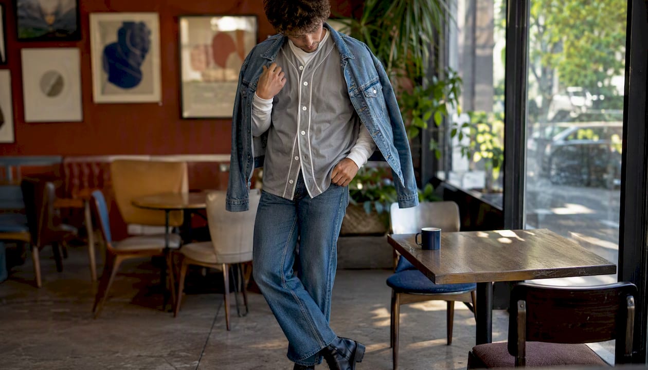 Layered cool-weather outfit with jersey and denim jacket