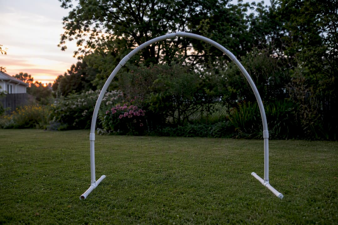 Freestanding segmented PVC arch frame outdoors