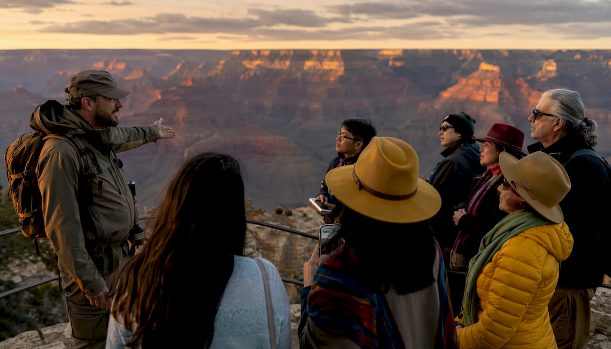 Tour group at canyon viewpoint listening to guide