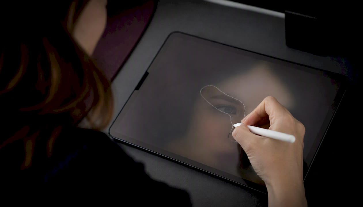 Hand manually masking face in photo