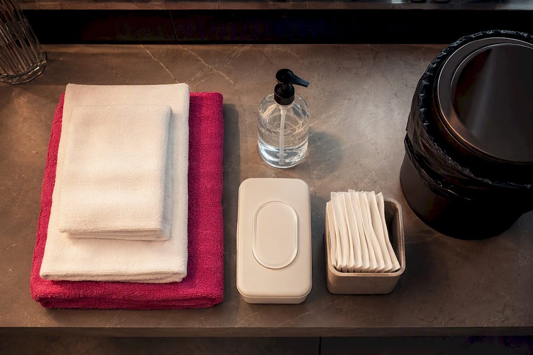 Towels sanitizer and wipes at party station