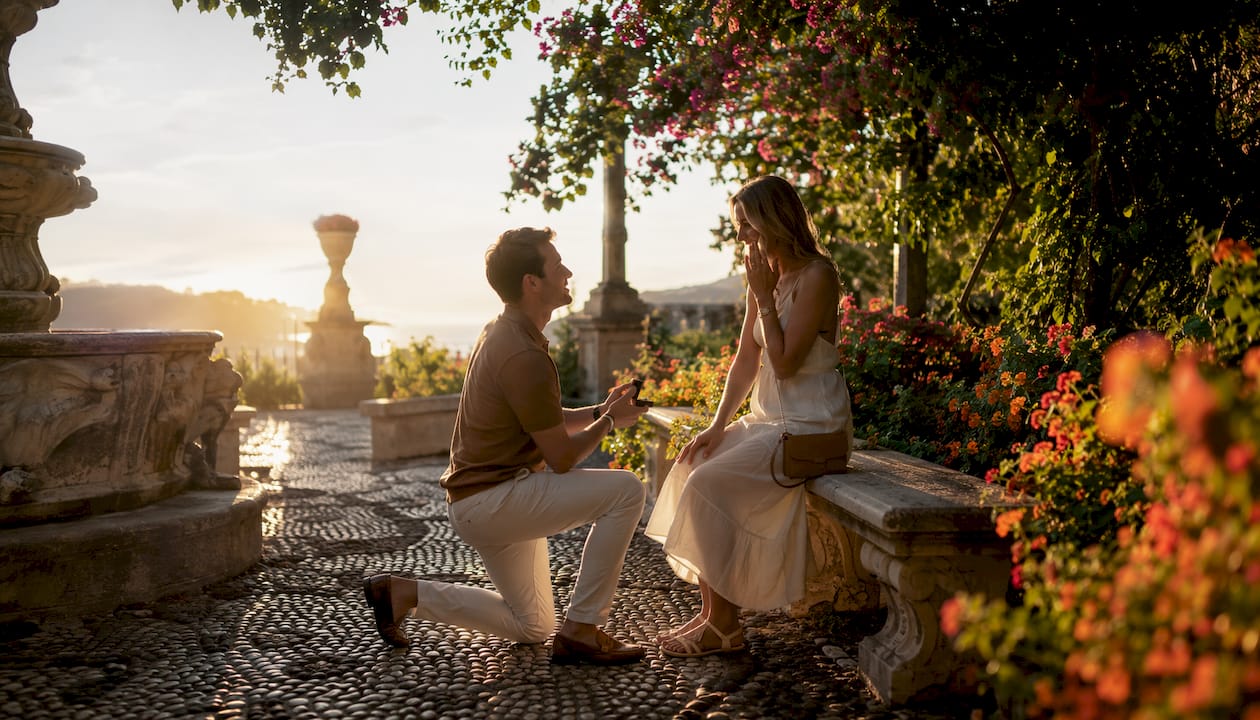 Couple sitting in Villa Comunale gardens in Sorrento