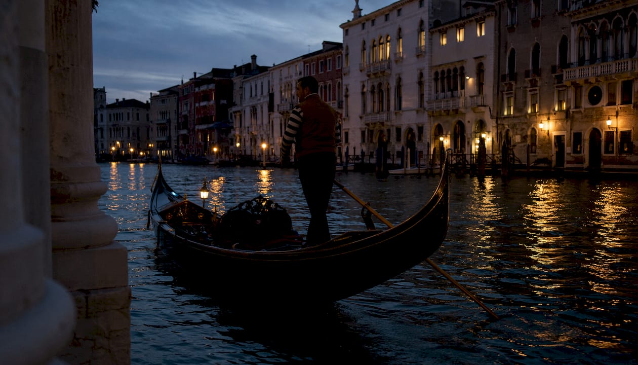 Gondola on Venice canal at blue hour