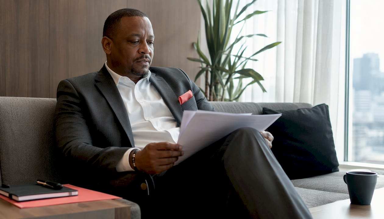 Security consultant reviewing budget paperwork
