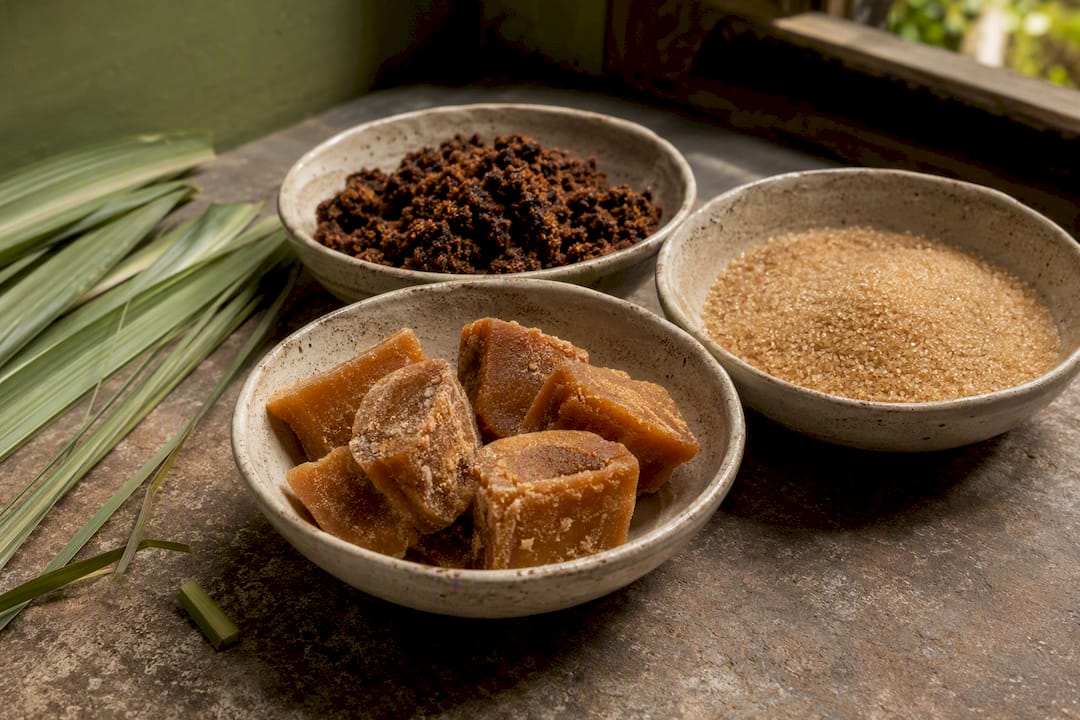 Three bowls with different organic sugar varieties