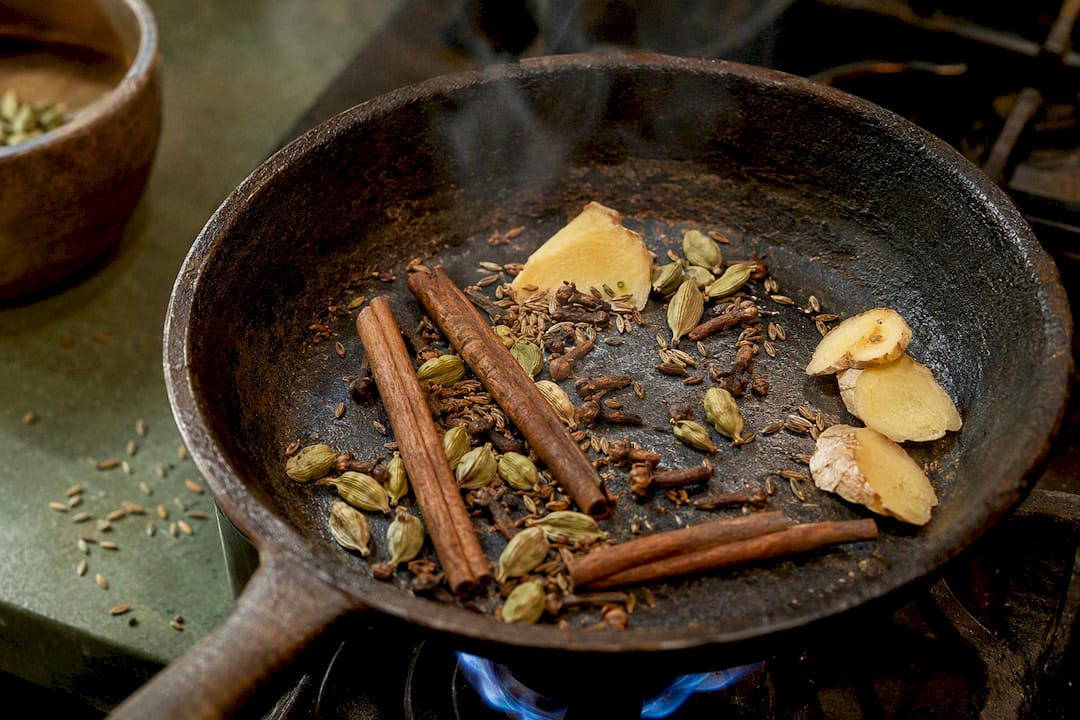 Chai spices toasting in dry pan