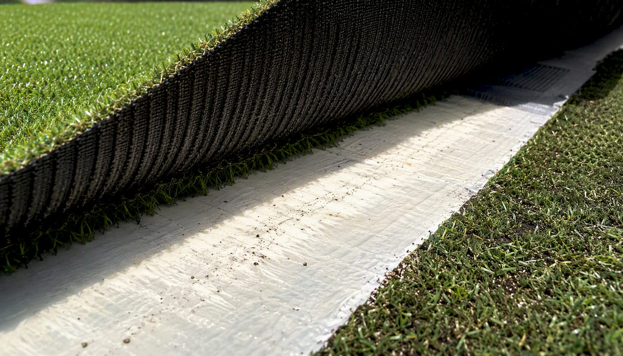 Detailed turf backing and seam close-up