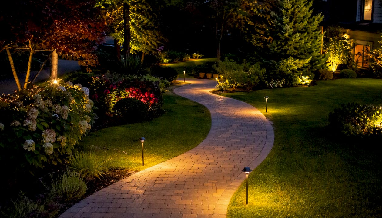 Curved garden path with staggered path lights
