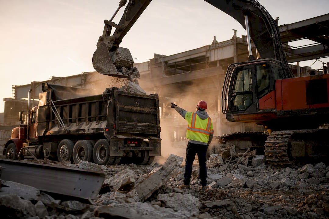 Live debris loading at active construction site
