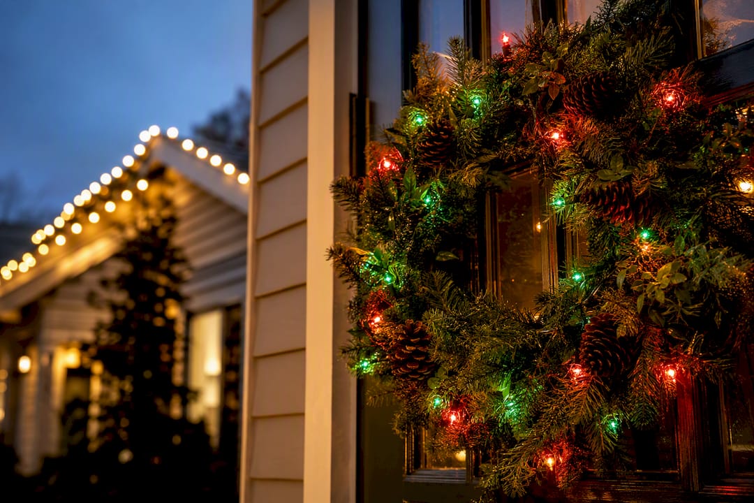 Wreath with red and green lights, warm white on roofline