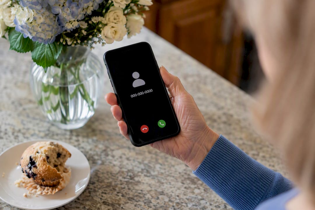 Smartphone showing suspicious caller ID