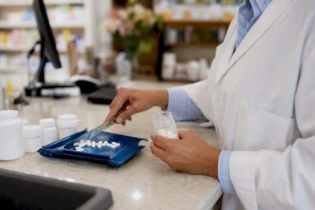 Pharmacist filling prescription medication