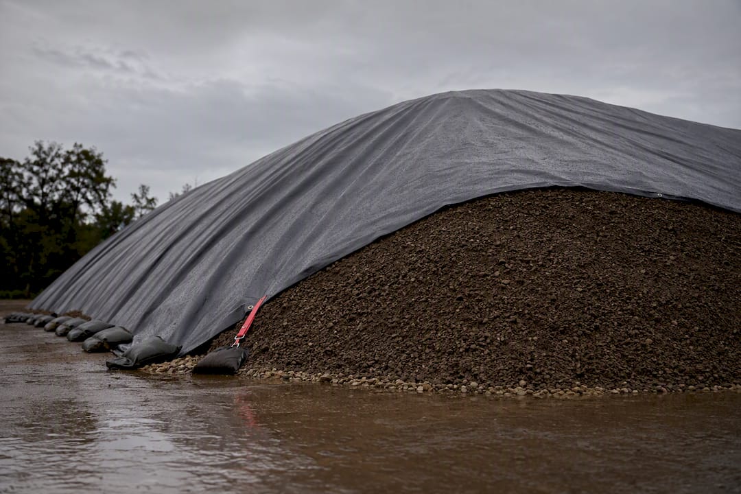 Covered borrow stockpile protected from rain