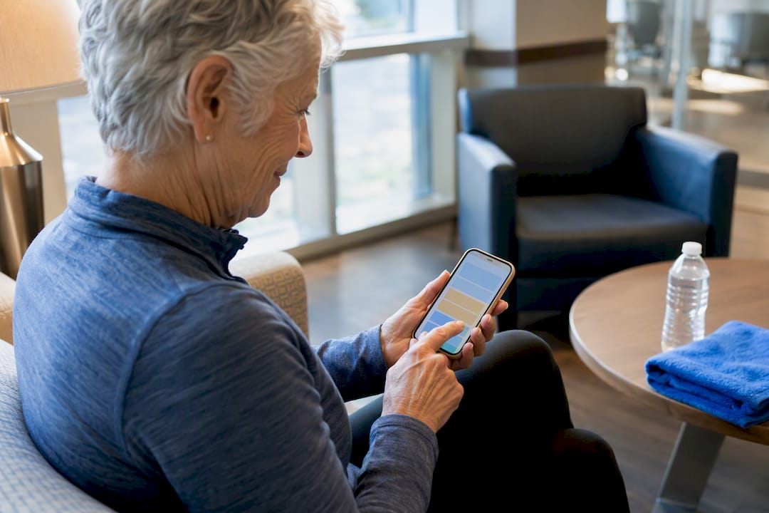 Older adult checking a fitness membership app