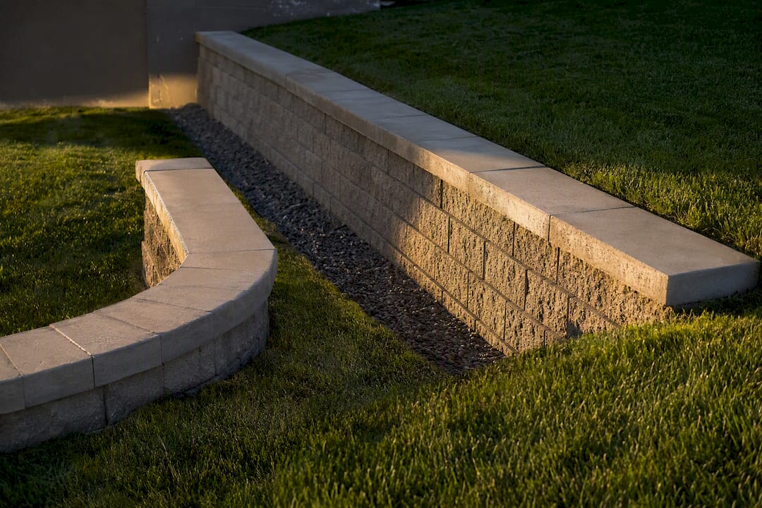 Seat wall retaining soil on sloped yard