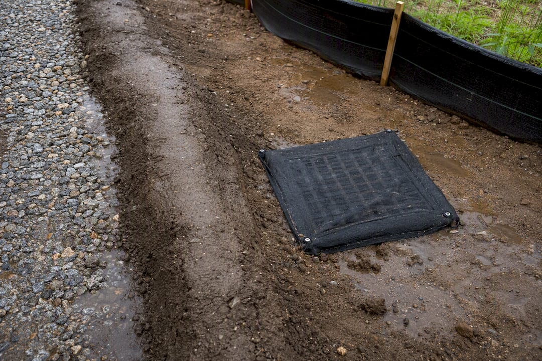 Berm protecting storm drain from demolition runoff