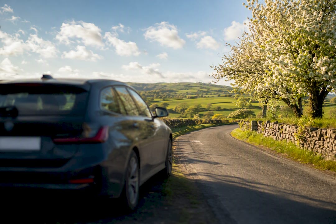 Car silhouette in Irish spring countryside