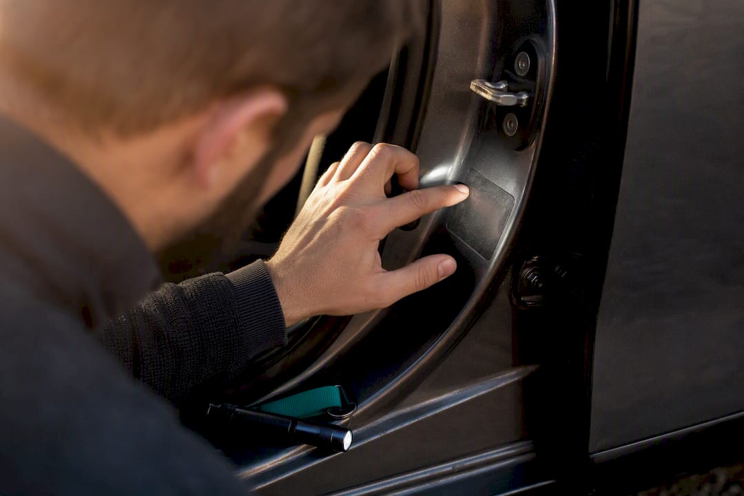 Buyer checking a vehicle VIN plate