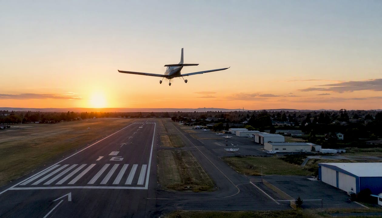 Training aircraft flying touch-and-go pattern