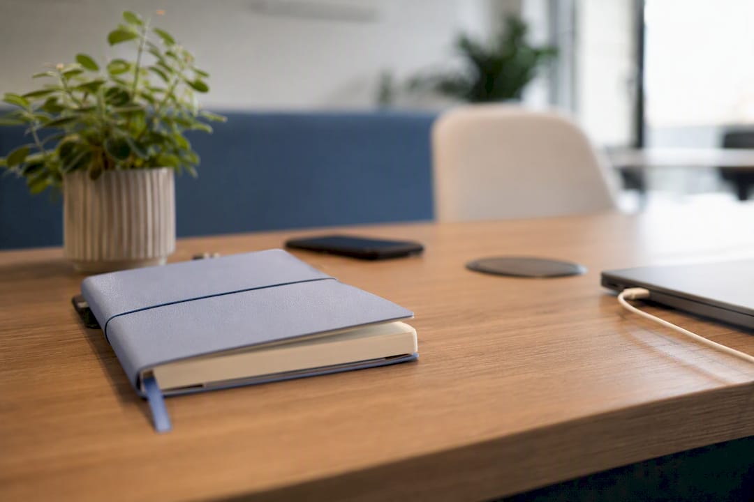 An inspiring coaching space with a tidy desk and a laptop within reach.