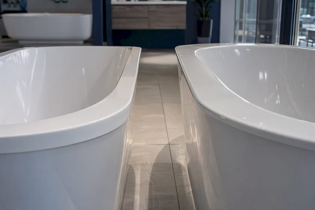 Close-up of bath rims showing width difference