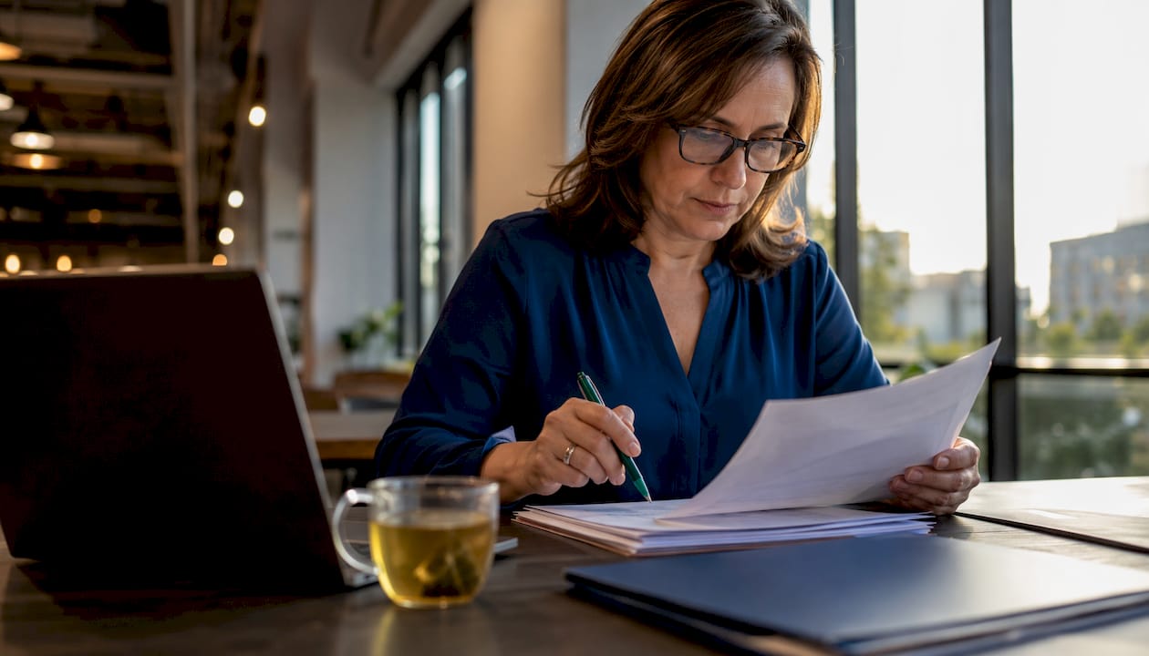 Compliance officer reviewing AI governance documents