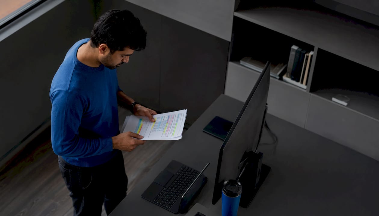 Man reviewing AI pilot deployment metrics