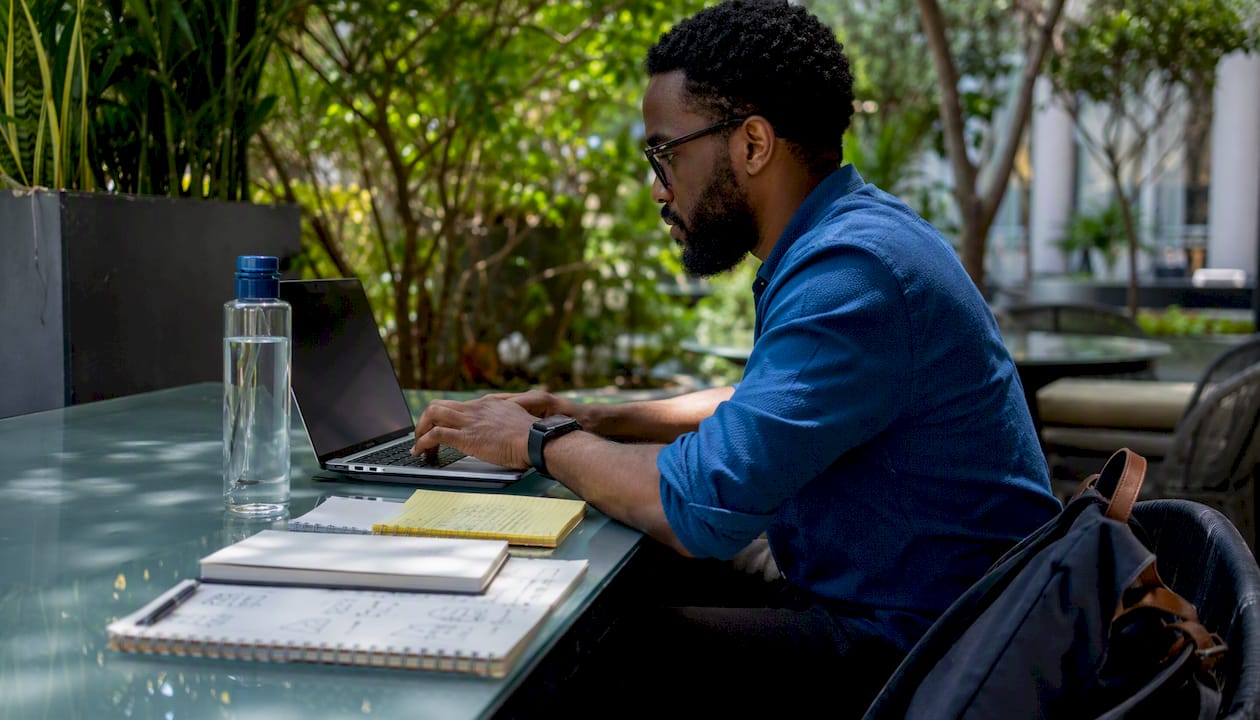 Man working on custom AI versus off-the-shelf evaluation